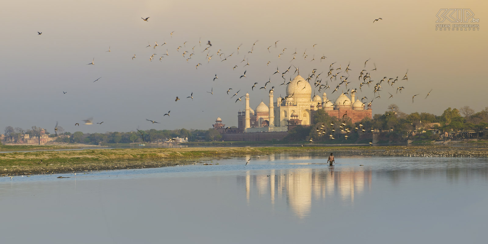 Agra - Yamuna river and Taj Mahal An hour before sunset I was making some long exposure photos of the wonderful Taj Mahal near the Yamuna river. I was using my ND filter to get a better reflection of the Taj in the water. Suddenly a flock of birds flew over the river. So I quickly changed my variable ND filter and increased the shutter speed to take some extra shots. Finally I liked this photo the most and I hope that it is a little bit different from all the other Taj Mahal photos.<br />
 Stefan Cruysberghs